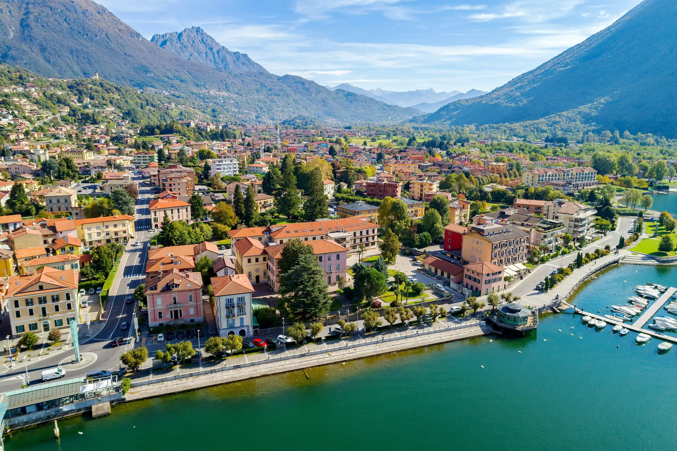 Lake Lugano with its lakeside promenade and the mountains of Ticino